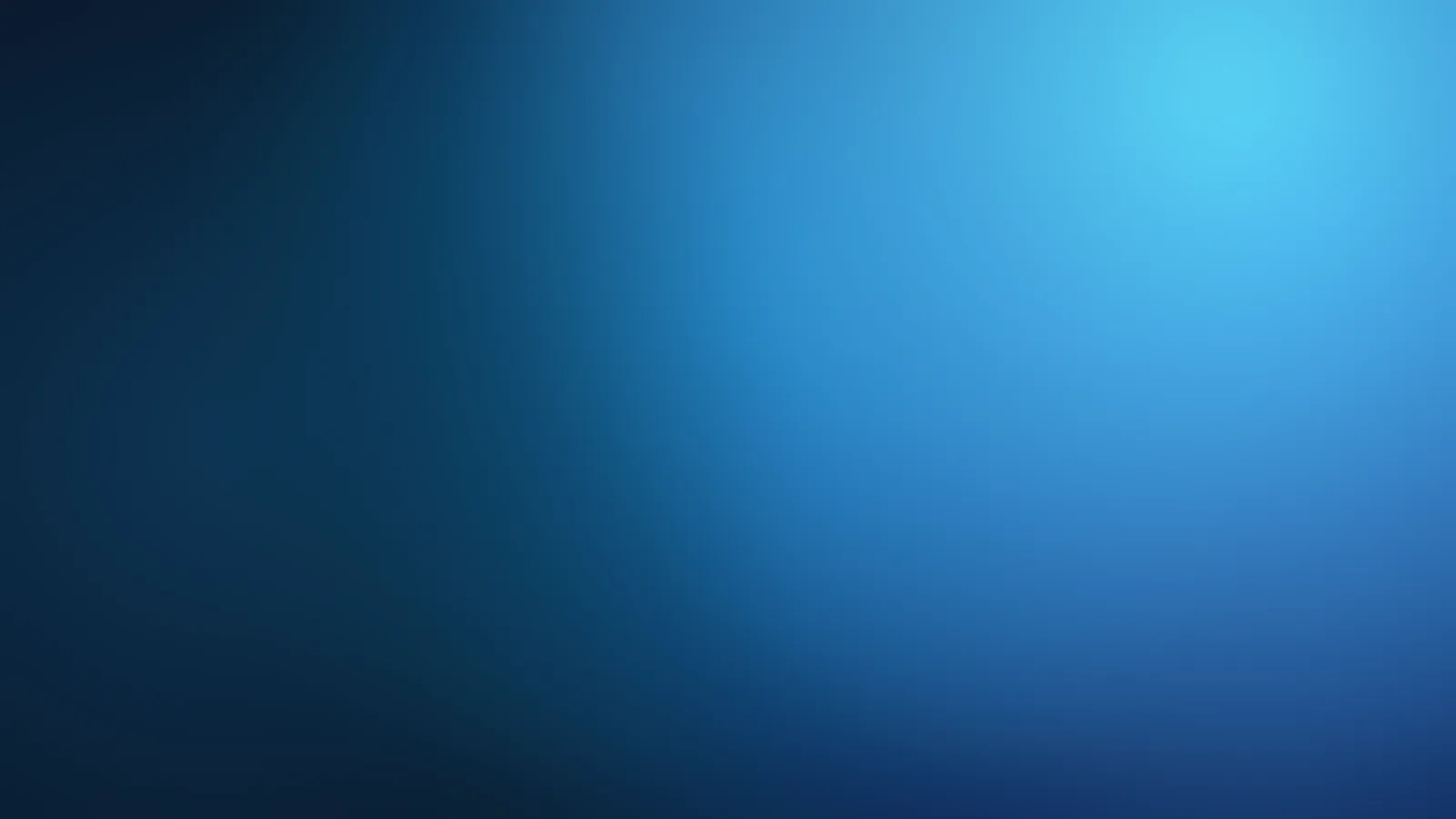 Teal and blue light over a dark ground